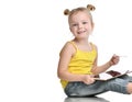 Young girl kid sitting reading learning drawing on digital tablet touch screen pad with pencil Royalty Free Stock Photo