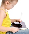 Young girl kid sitting reading learning drawing on digital tablet touch screen pad with pencil Royalty Free Stock Photo