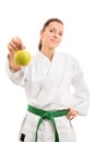 Young girl in kimono holding an apple Royalty Free Stock Photo