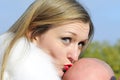 The young girl kisses a bald head of the man Royalty Free Stock Photo