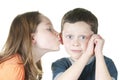 Young girl kissing boy on cheek