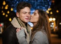 Young girl kissing her boyfriend or a friend on the cheek Royalty Free Stock Photo