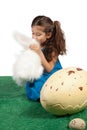 Young girl kissing her toy bunny