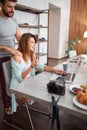 Girl in the kitchen with her boyfriend enjoying in nice morning