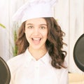 Young girl at kitchen. Little cook chef. Cute female portrait. Baker smile professional Royalty Free Stock Photo