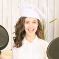 Young girl at kitchen. Little cook chef. Cute female portrait. Baker smile Royalty Free Stock Photo