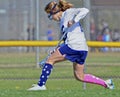 Young Girl Lacrosse Player Running for the Ball Royalty Free Stock Photo