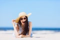 Young girl laying on the beach, smiling. Royalty Free Stock Photo