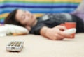 Young Girl Laying On Floor Looking At Television