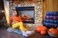 Young girl with leaf is sitting in the room with Royalty Free Stock Photo