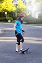 Young girl learning to use skateboard or rip stick Royalty Free Stock Photo