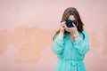 A young girl learns how to use her photo camera during a course Royalty Free Stock Photo