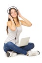 Young girl listening music by headphones Royalty Free Stock Photo