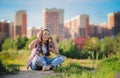 Young girl listening to music on headphones, urban street style, outdoor street style hipster dj woman in black cap and