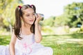 Young girl listening through tin can phone Royalty Free Stock Photo