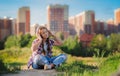 Young girl listening to music on headphones, urban street style, outdoor street style hipster dj woman in black cap and