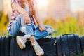 young girl listening to music on headphones, urban street style, outdoor street style hipster woman