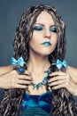 Young girl with long African braids in a blue dress Royalty Free Stock Photo