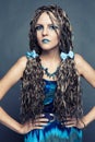 Young girl with long African braids in a blue dress Royalty Free Stock Photo