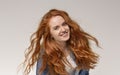 Young girl with long beautiful ginger hair smiling to camera Royalty Free Stock Photo