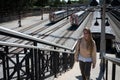 young girl in long hair blonde with sweatshirt walking up the stairs of the Chicago train station Royalty Free Stock Photo