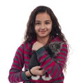 Young girl with long hair and gray kitten in the hands posing on a white background Royalty Free Stock Photo