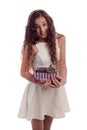 Young girl with long hair and gray kitten in the hands posing on a white background Royalty Free Stock Photo