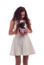 Young girl with long hair and gray kitten in the hands posing on a white background Royalty Free Stock Photo