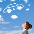 Young girl looking at car cloud on a blue sky Royalty Free Stock Photo