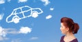 Young girl looking at car cloud on a blue sky Royalty Free Stock Photo