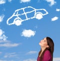 Young girl looking at car cloud on a blue sky Royalty Free Stock Photo