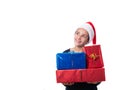 Young girl looking hopeful and holding Christmas presents Royalty Free Stock Photo