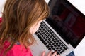 Young girl looking at laptop screen Royalty Free Stock Photo