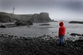 Young Girl Looking at Lighhouse Royalty Free Stock Photo