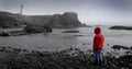 Young Girl Looking at Lighhouse Royalty Free Stock Photo