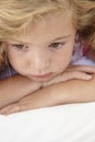 Young Girl Looking Sad On Bed In Bedroom Royalty Free Stock Photo