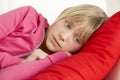 Young Girl Looking Sad On Sofa Royalty Free Stock Photo