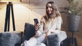 Young girl looking on screen of her smartphone. Female texting and sending messages on mobile phone. Entertainment apps and