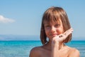 Young girl looking for seashells at the beach Royalty Free Stock Photo