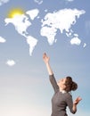 Young girl looking at world clouds and sun on blue sky Royalty Free Stock Photo