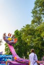 Rotation Carnival Ride Against Blue Sky.