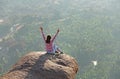 A young girl in a lotus pose is greeting the sun on a background