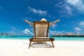 Young girl lying on a beach lounger his arms making 'thumbs up' Royalty Free Stock Photo