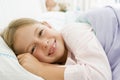 Young Girl Lying Down In Her Bed Royalty Free Stock Photo