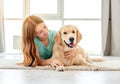 Young girl lying with golden retriever Royalty Free Stock Photo