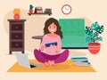 A young girl is lying on the floor at home with a laptop and books