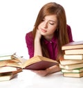 Young girl is lying on a floor and reading book Royalty Free Stock Photo