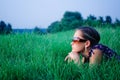 Young girl lying in green grass Royalty Free Stock Photo