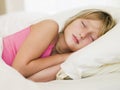 Young Girl Lying In Her Bed