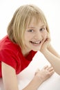 Young Girl Lying On Stomach In Studio Royalty Free Stock Photo